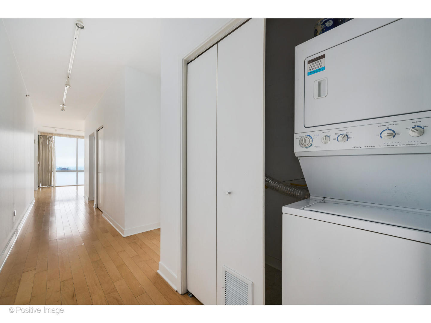 8 East Randolph Street, Unit 2808 Chicago, IL 60601 - Photo 14 of 22 a view of washer and dryer with bathroom in the background