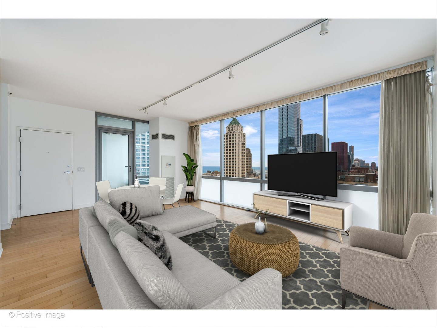 8 East Randolph Street, Unit 2808 Chicago, IL 60601 - Photo 5 of 22 a living room with furniture and a flat screen tv