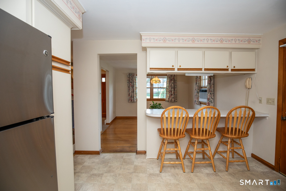 153 Fiesta Heights Meriden, CT 06451 - Photo 8 of 32 Breakfast bar overlooks dining room