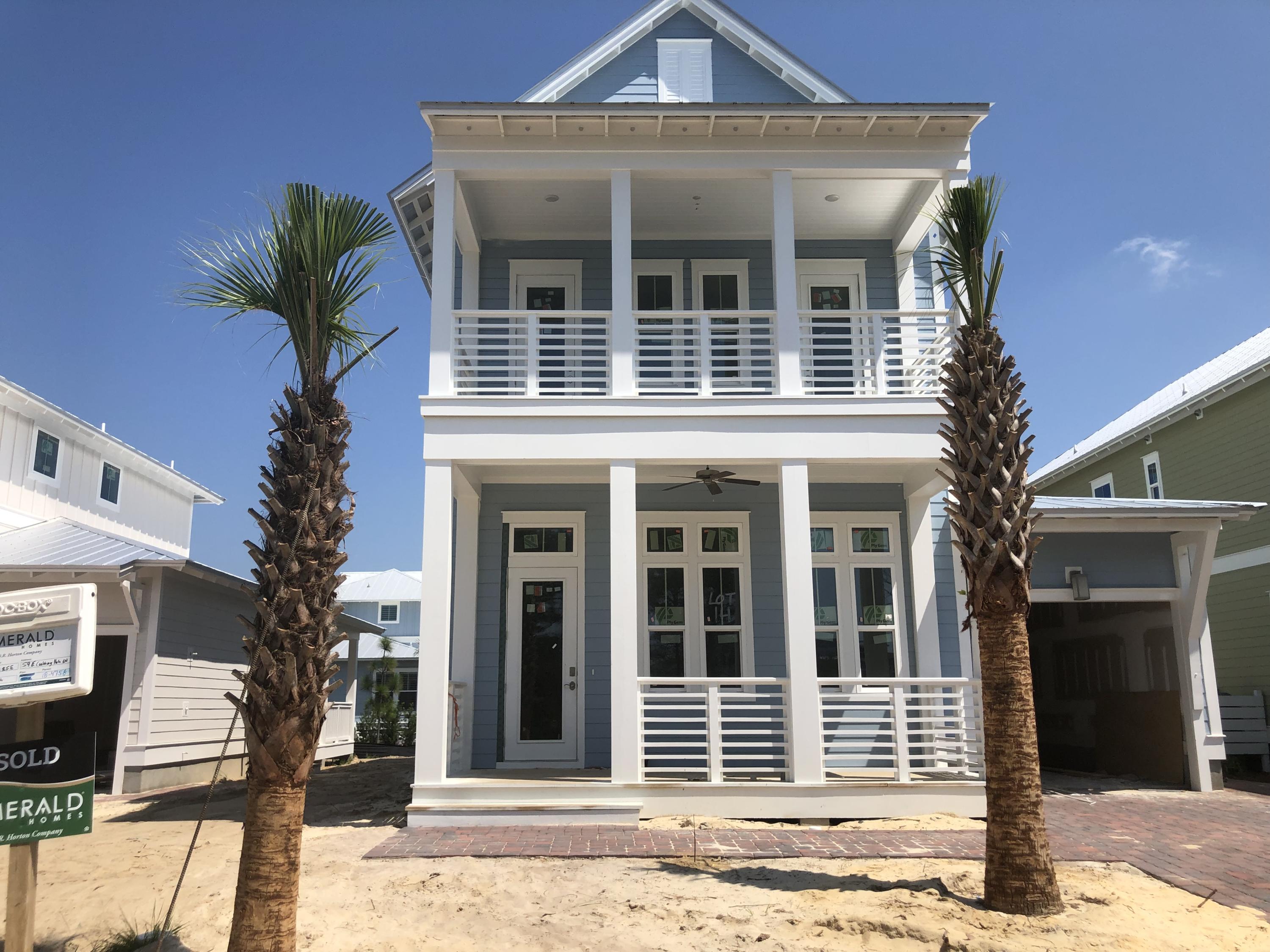 59 East Crabbing Hole Ln Inlet Beach Inlet Beach, FL 32461 - Photo 1 of 62 a front view of a house with plants