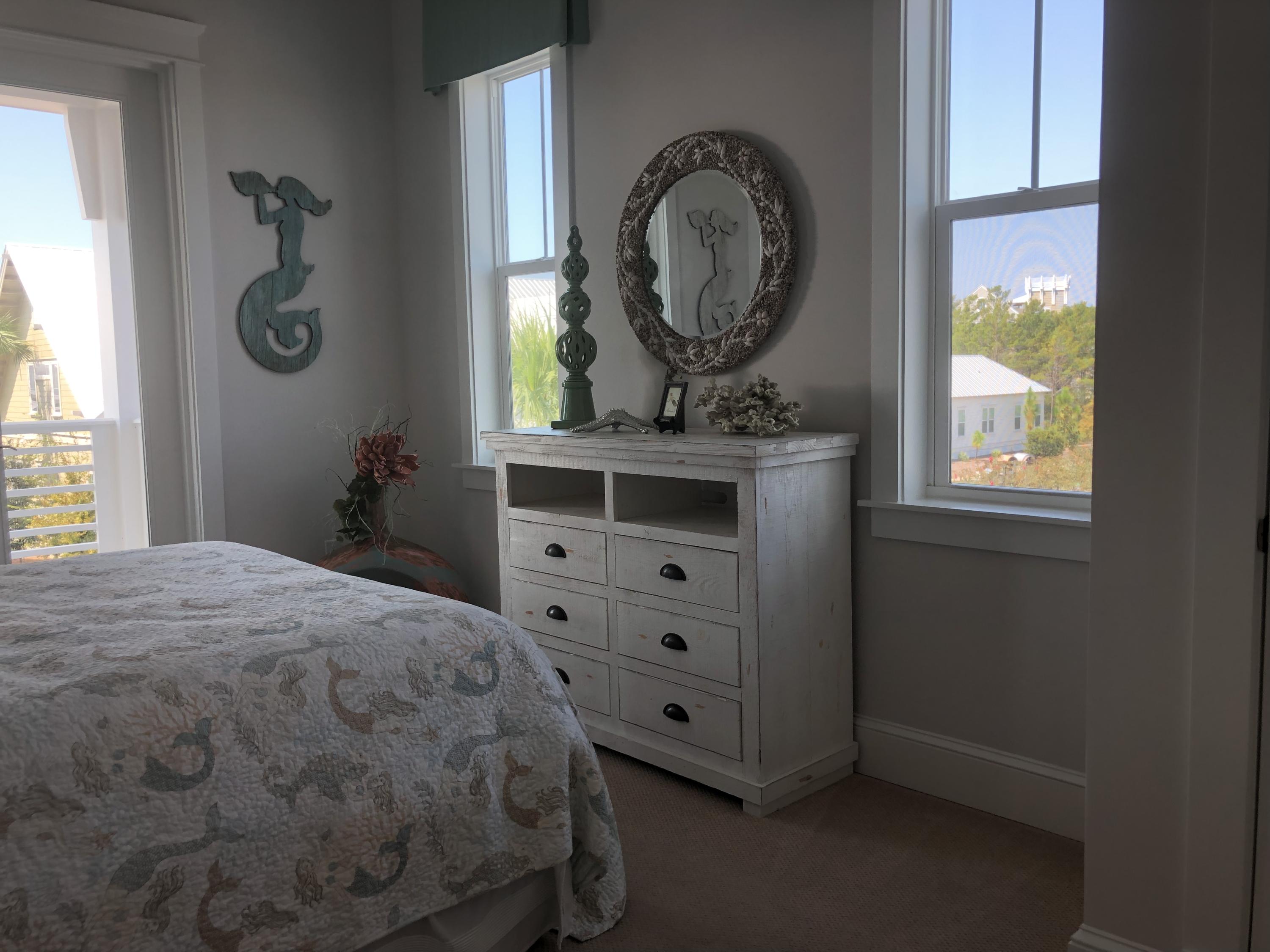 59 East Crabbing Hole Ln Inlet Beach Inlet Beach, FL 32461 - Photo 51 of 62 a bedroom with a bed and a window