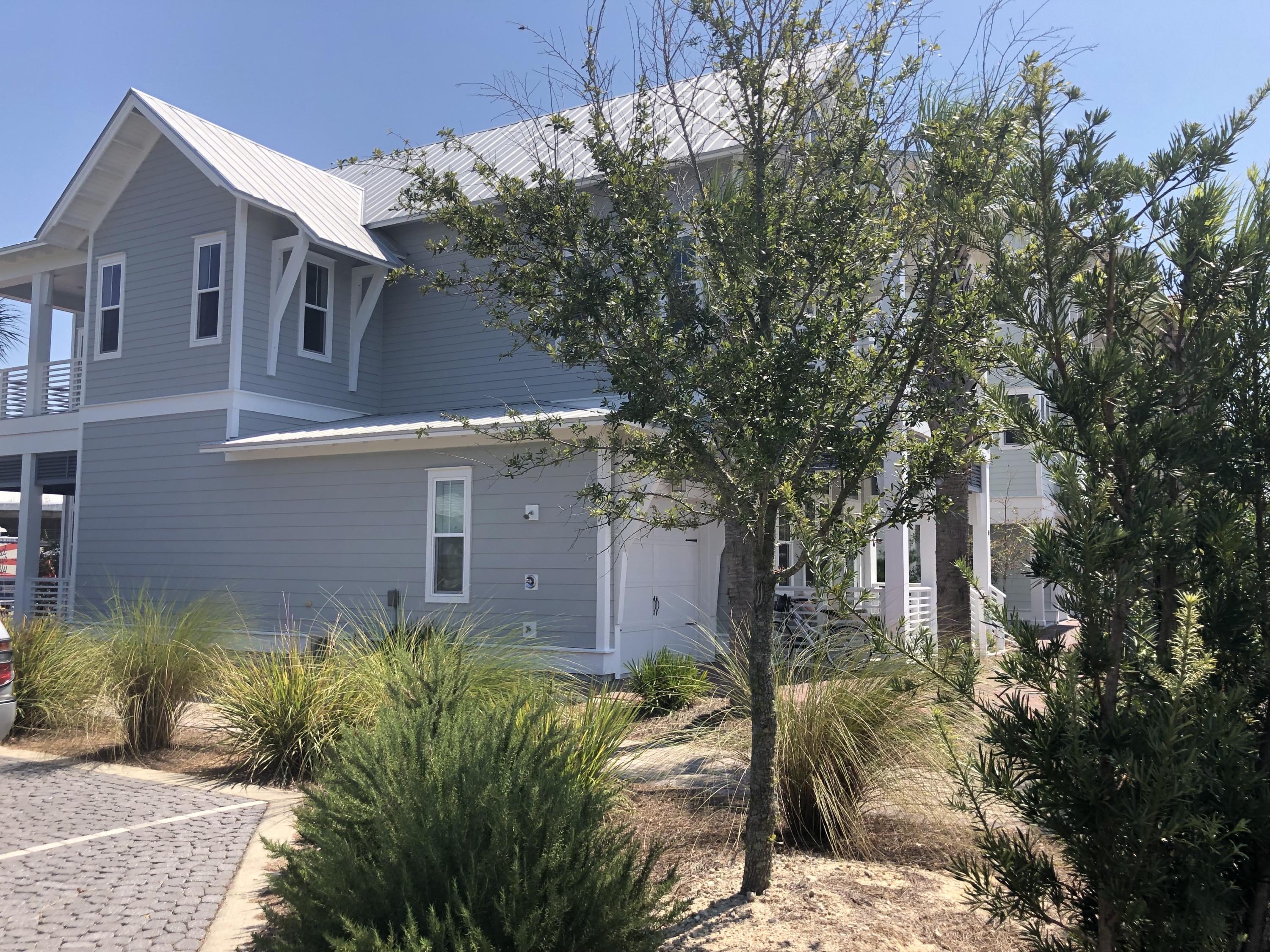 59 East Crabbing Hole Ln Inlet Beach Inlet Beach, FL 32461 - Photo 62 of 62 a front view of a house with garden