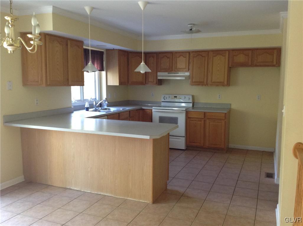 4801 Cedar Grove Road Bangor, PA 18013 - Photo 3 of 12 a kitchen with kitchen island granite countertop a sink a counter top space and cabinets