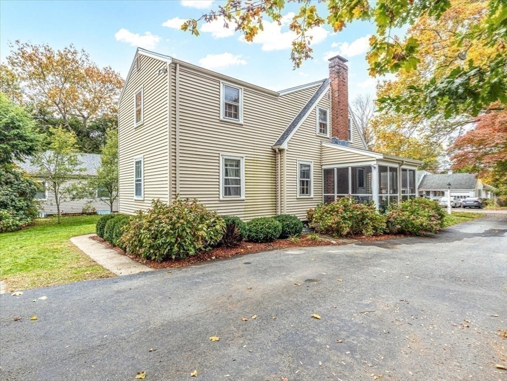 46 Park Street Dedham, MA 02026 - Photo 26 of 35 a front view of a house with garden