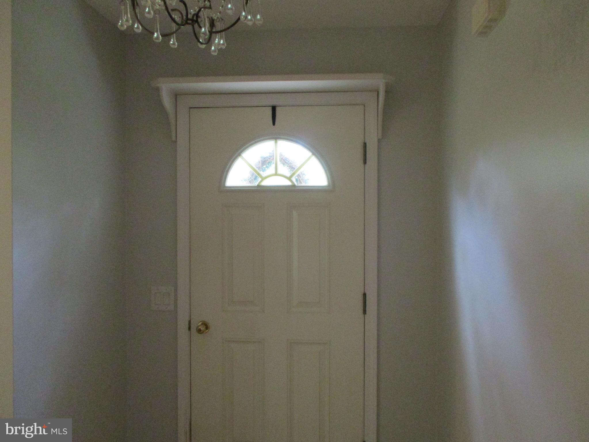 1007 Jordan Springs Road Stephenson, VA 22656 - Photo 5 of 41 Foyer is 12x4 with a Lovely Chandelier
