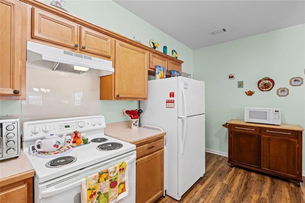 460 Tribble Gap Road, Unit 102 Cumming, GA 30040 - Photo 12 of 21 a utility room with fridge dryer and washer