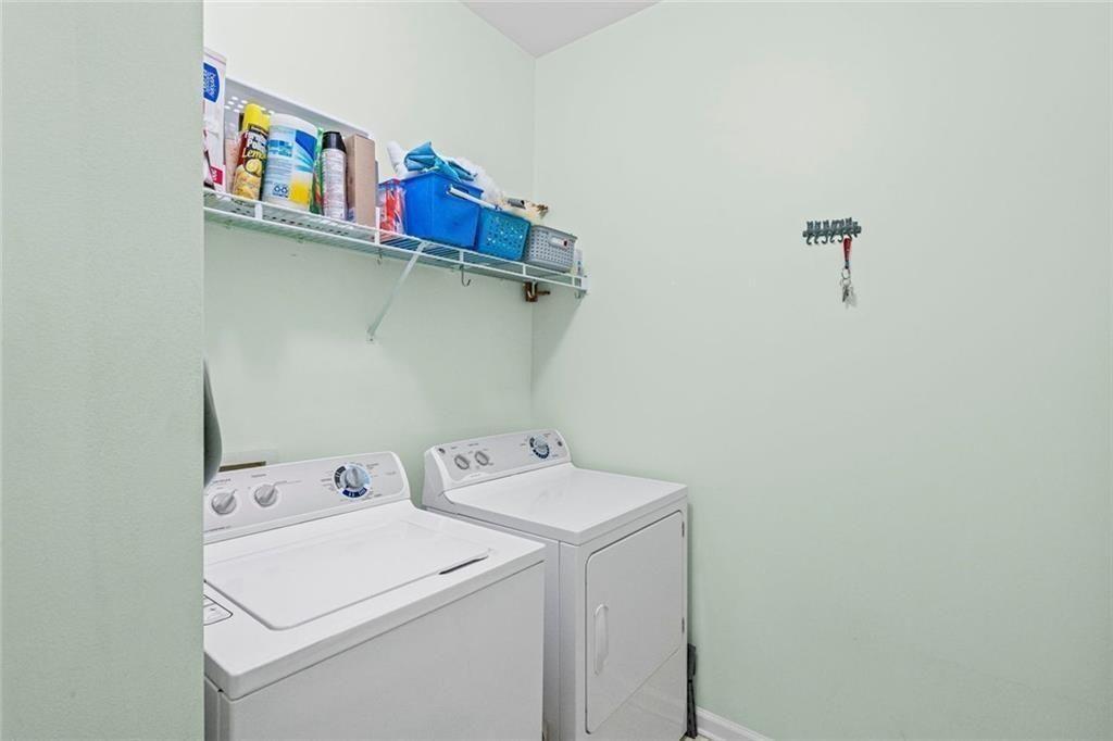 460 Tribble Gap Road, Unit 102 Cumming, GA 30040 - Photo 16 of 21 a utility room with dryer and washer