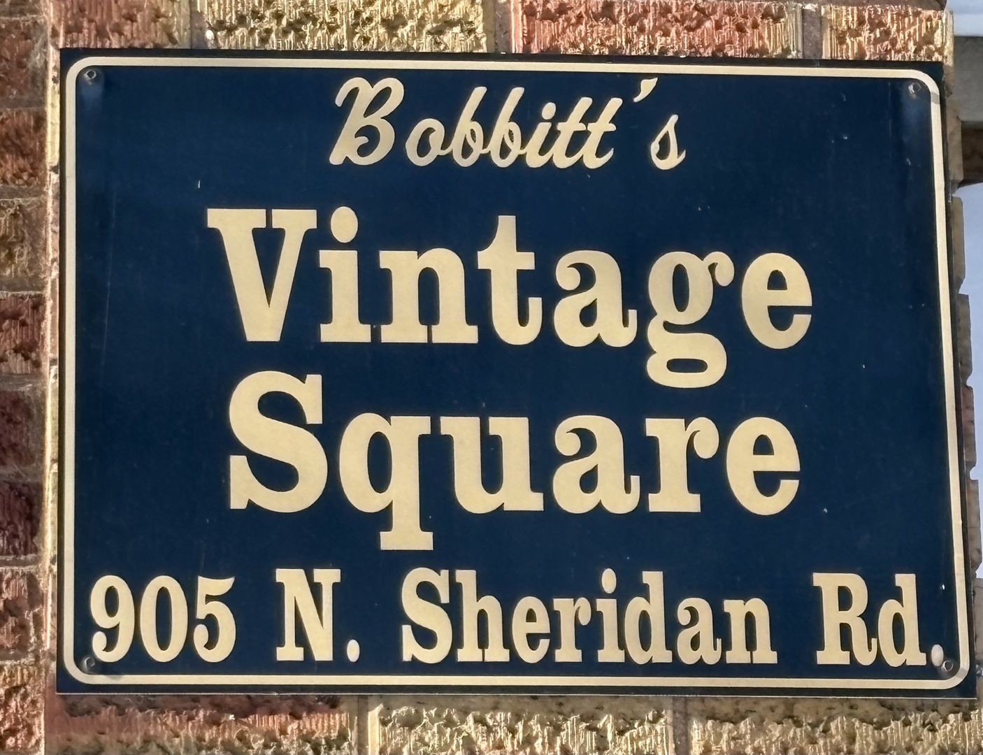 905 North Sheridan Road, Unit F Peoria, IL 61606 - Photo 2 of 11 a close up of a street sign