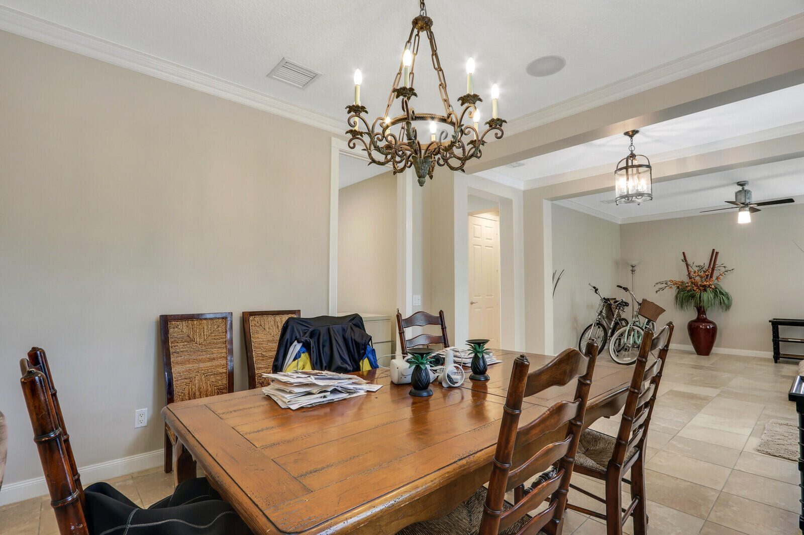 101 St Pierre Way Jupiter, FL 33458 - Photo 9 of 57 a view of a dining room with furniture and chandelier