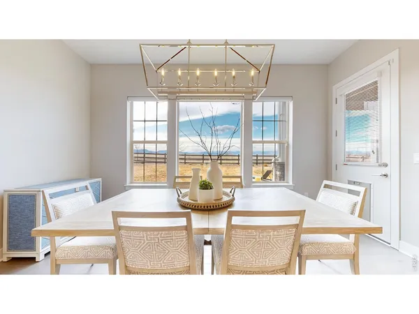 a living room with a table and chairs