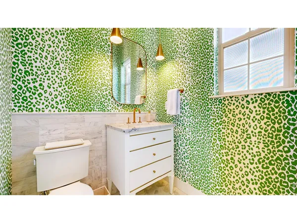 a bathroom with a sink a mirror and a shower