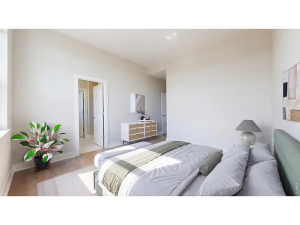 a bedroom with a bed and a couch