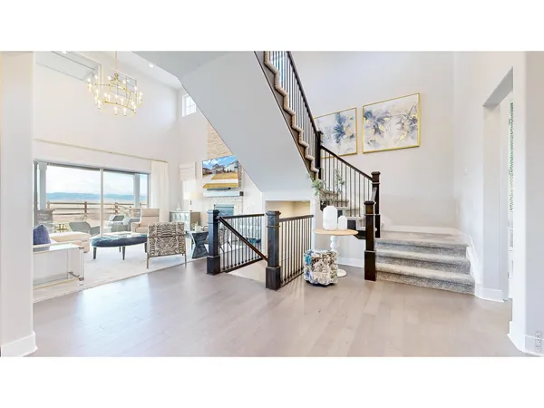 a room with lots of furniture and wooden floor
