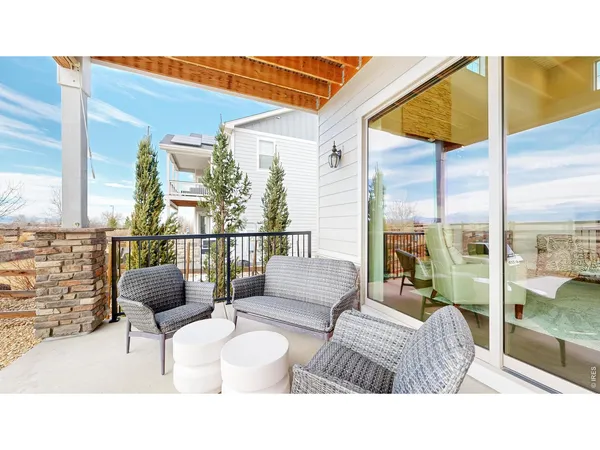 a balcony with furniture and outdoor view