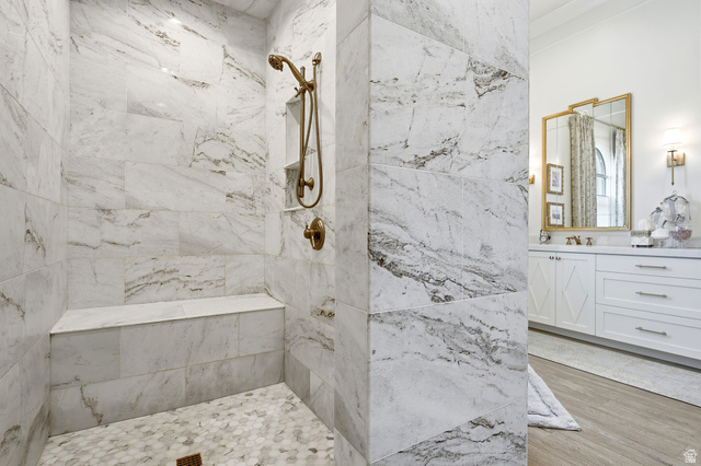 71 Farm Road Midway, UT 84049 - Photo 37 of 92 Spacious shower featuring full-height marble-look tile, a built-in bench, and a bronze-finish shower system