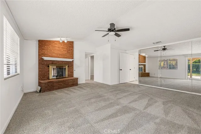 a large white kitchen with a large window