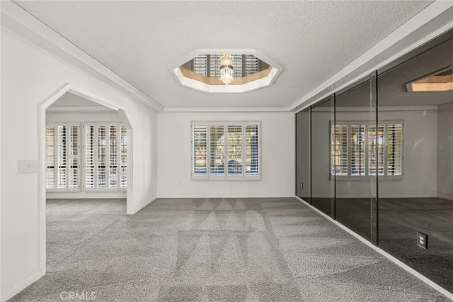 a view of a kitchen with a sink and a window