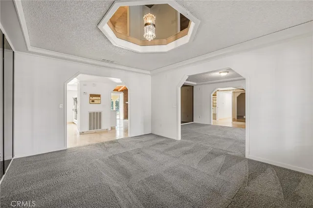 a view of a kitchen with a sink and cabinets
