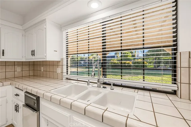 an empty room with a empty space and windows