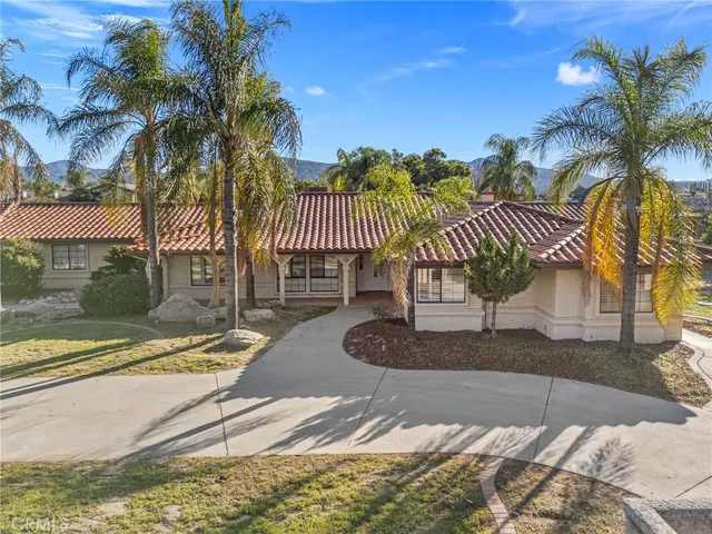 a view of a porch with wooden floor and fence