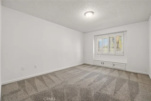 a view of a yard and an ocean view