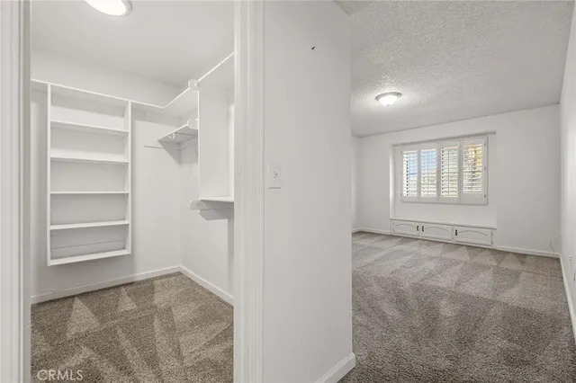 a front view of a house with a wooden fence