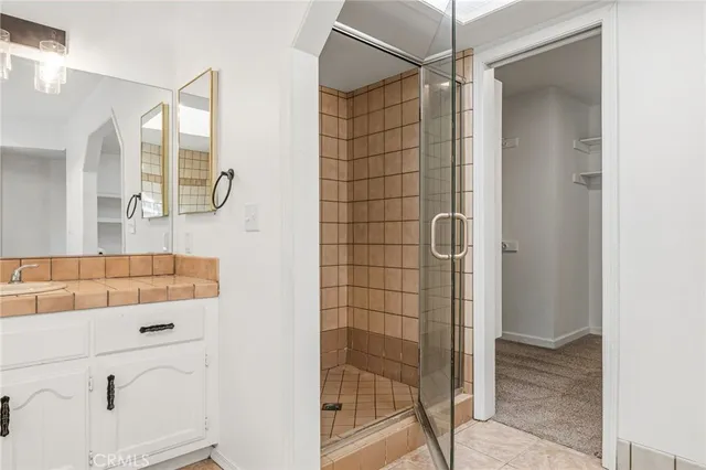 an aerial view of a house with a yard and a lake view