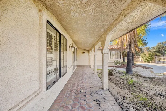 a view of an empty room with a fireplace