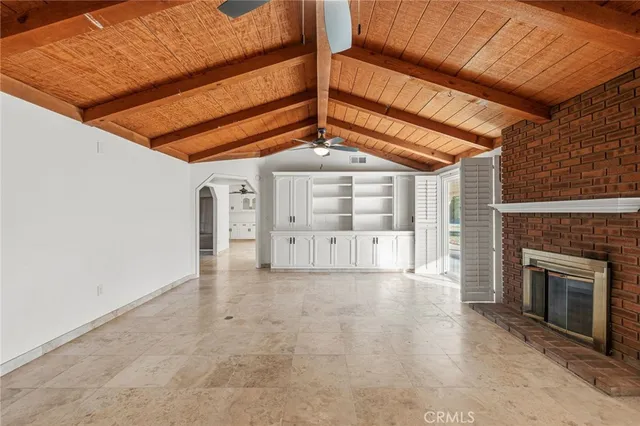 a view of an empty room with a fireplace