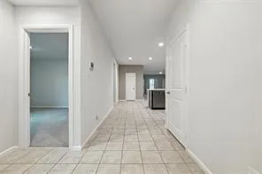 a view of a hallway with a bathroom