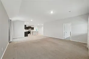 a view of kitchen and refrigerator in a kitchen