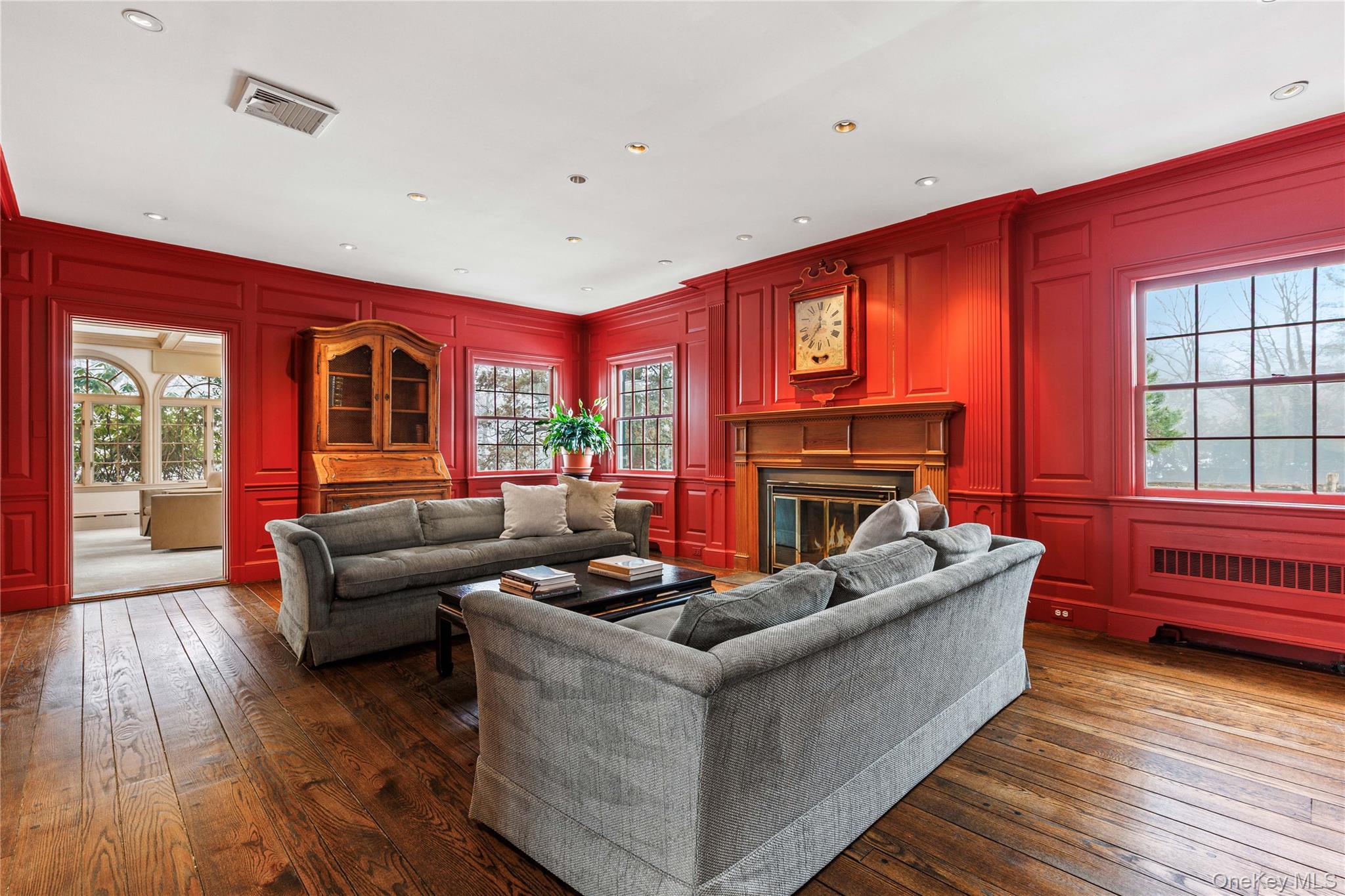 25 Stratford Road Harrison, NY 10528 - Photo 11 of 47 a living room with furniture and a fireplace