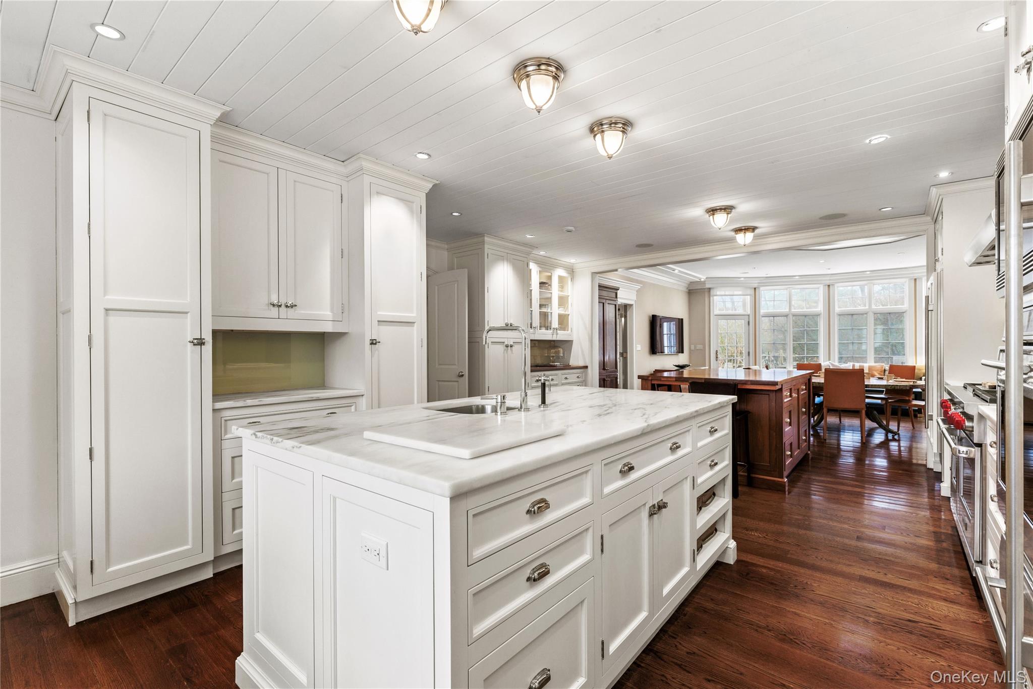 25 Stratford Road Harrison, NY 10528 - Photo 19 of 47 a large white kitchen with lots of counter space