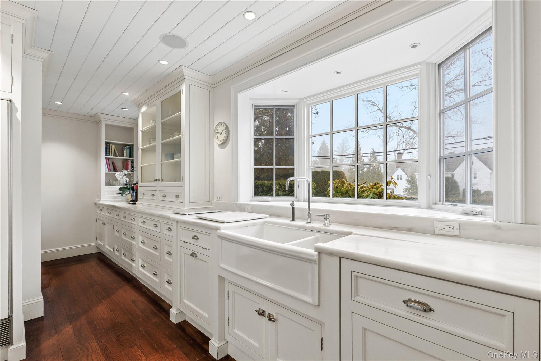 25 Stratford Road Harrison, NY 10528 - Photo 21 of 47 a bathroom with a sink and a large window
