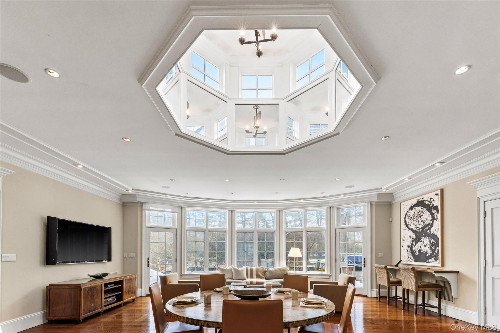 25 Stratford Road Harrison, NY 10528 - Photo 26 of 47 a living room with furniture and a flat screen tv