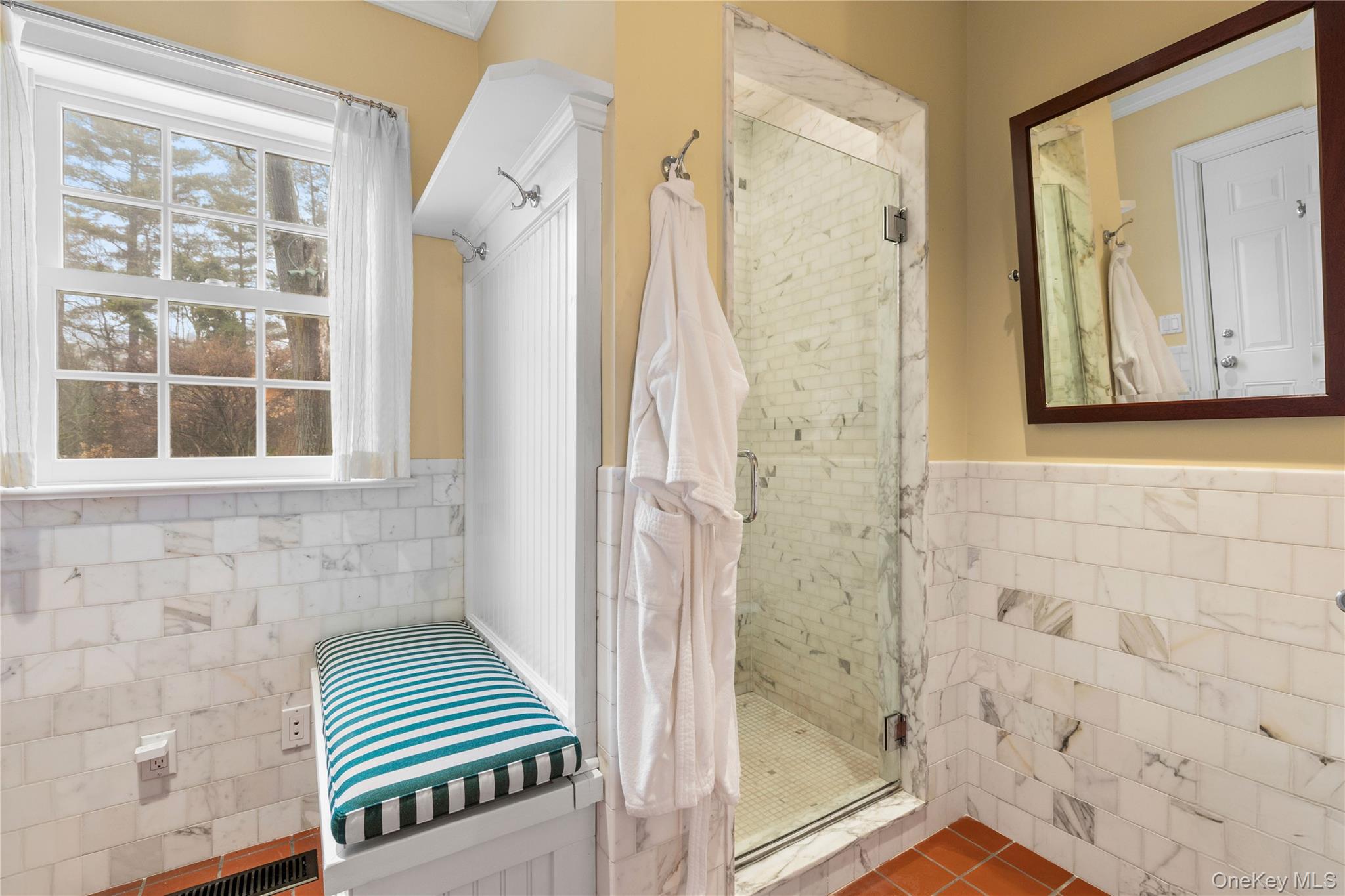 25 Stratford Road Harrison, NY 10528 - Photo 27 of 47 a bathroom with a window and a shower