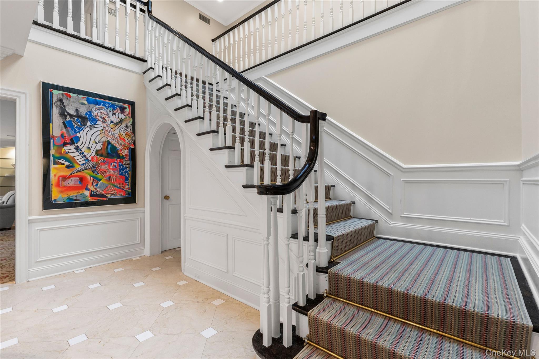 25 Stratford Road Harrison, NY 10528 - Photo 28 of 47 a view of entryway with wooden floor and stairs