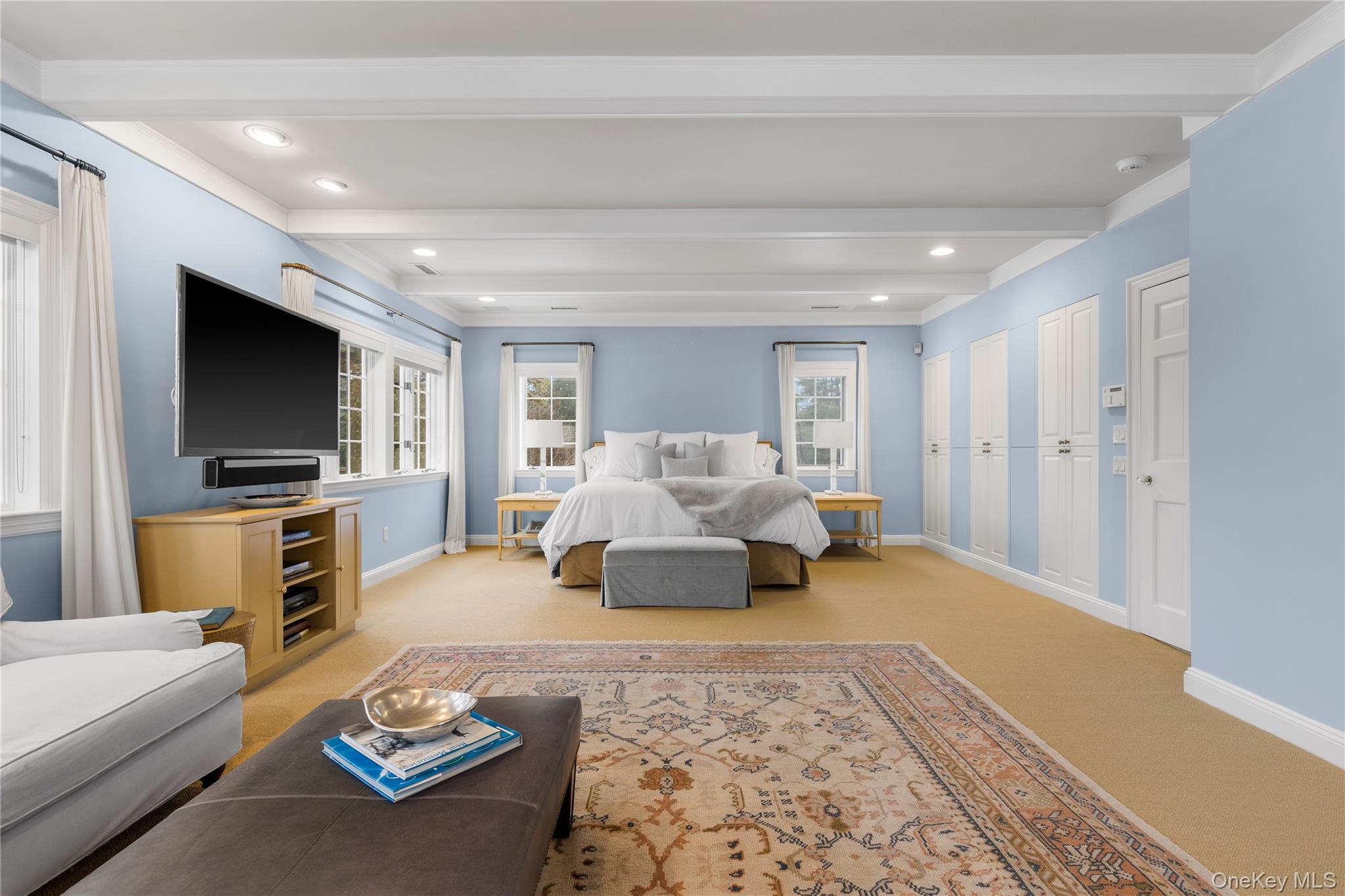 25 Stratford Road Harrison, NY 10528 - Photo 30 of 47 a living room with furniture and a flat screen tv