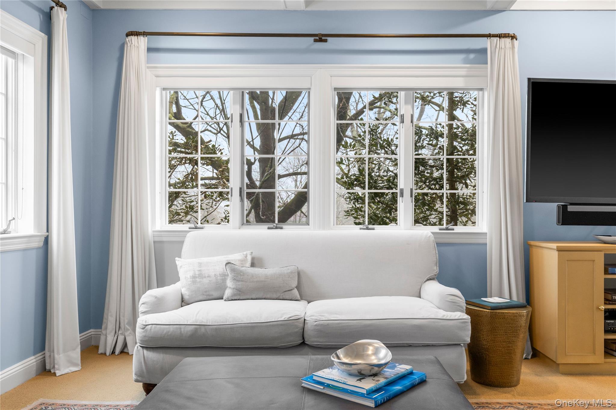 25 Stratford Road Harrison, NY 10528 - Photo 31 of 47 a living room with furniture and a window