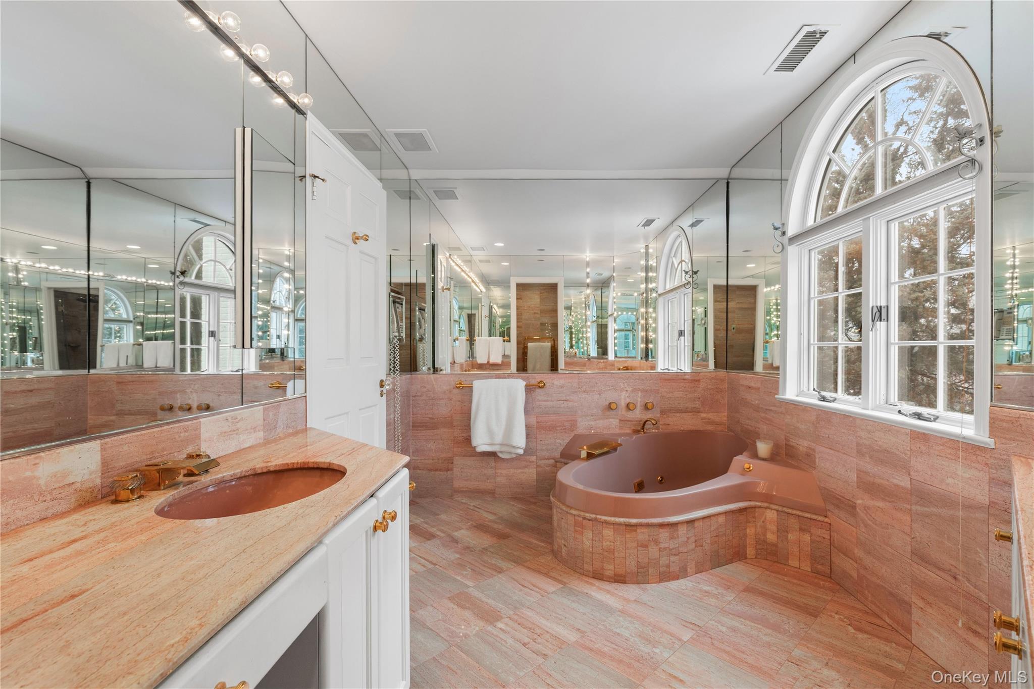 25 Stratford Road Harrison, NY 10528 - Photo 32 of 47 a kitchen with a stove a sink and a large window