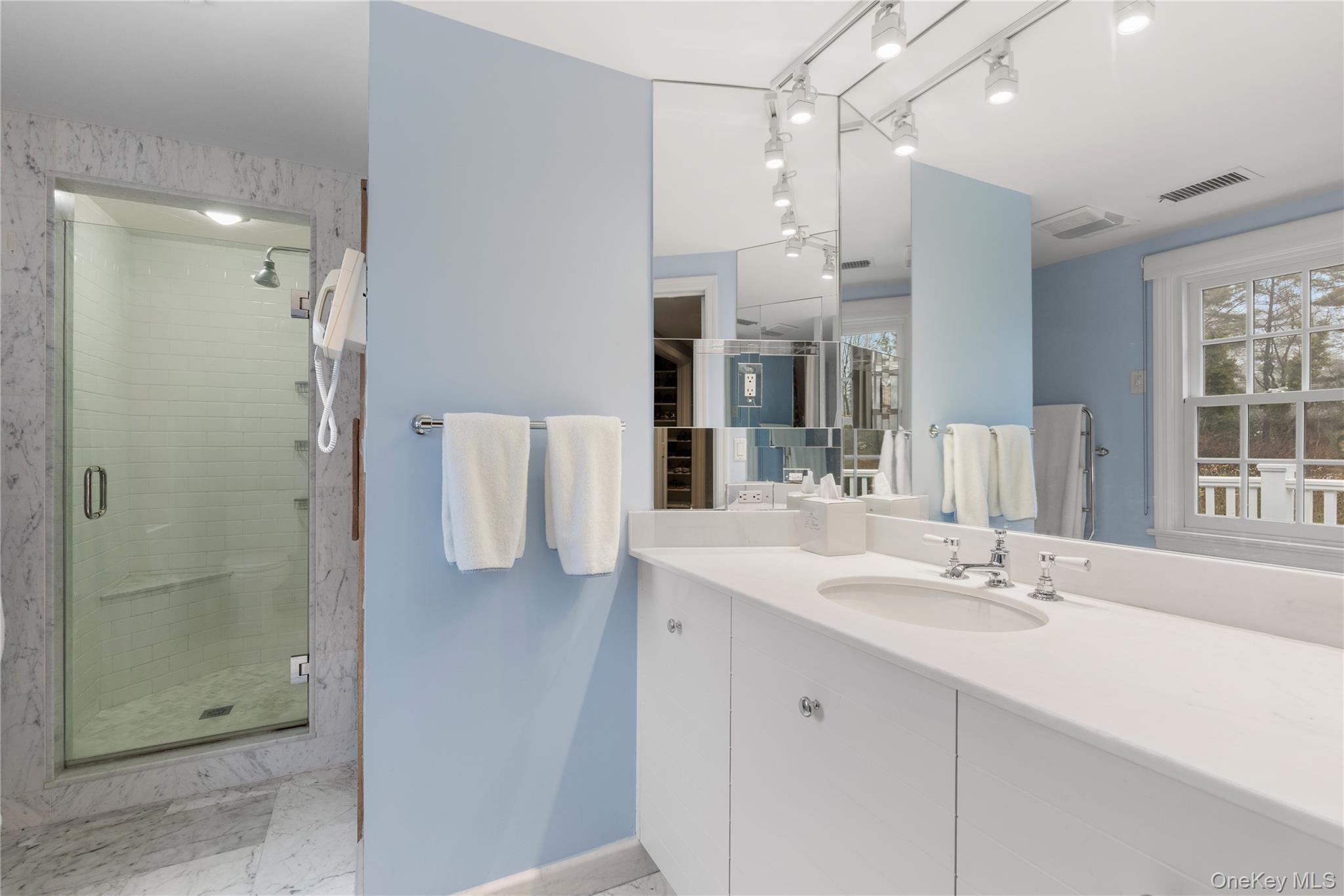 25 Stratford Road Harrison, NY 10528 - Photo 33 of 47 a bathroom with a sink double vanity and shower