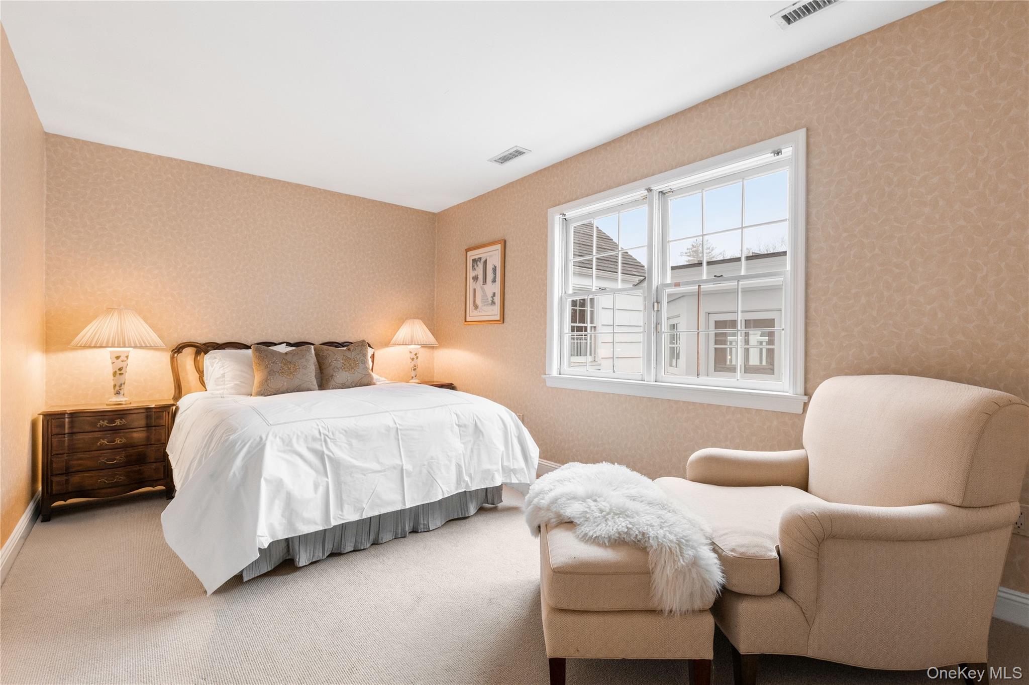 25 Stratford Road Harrison, NY 10528 - Photo 35 of 47 a bedroom with a bed and a couch