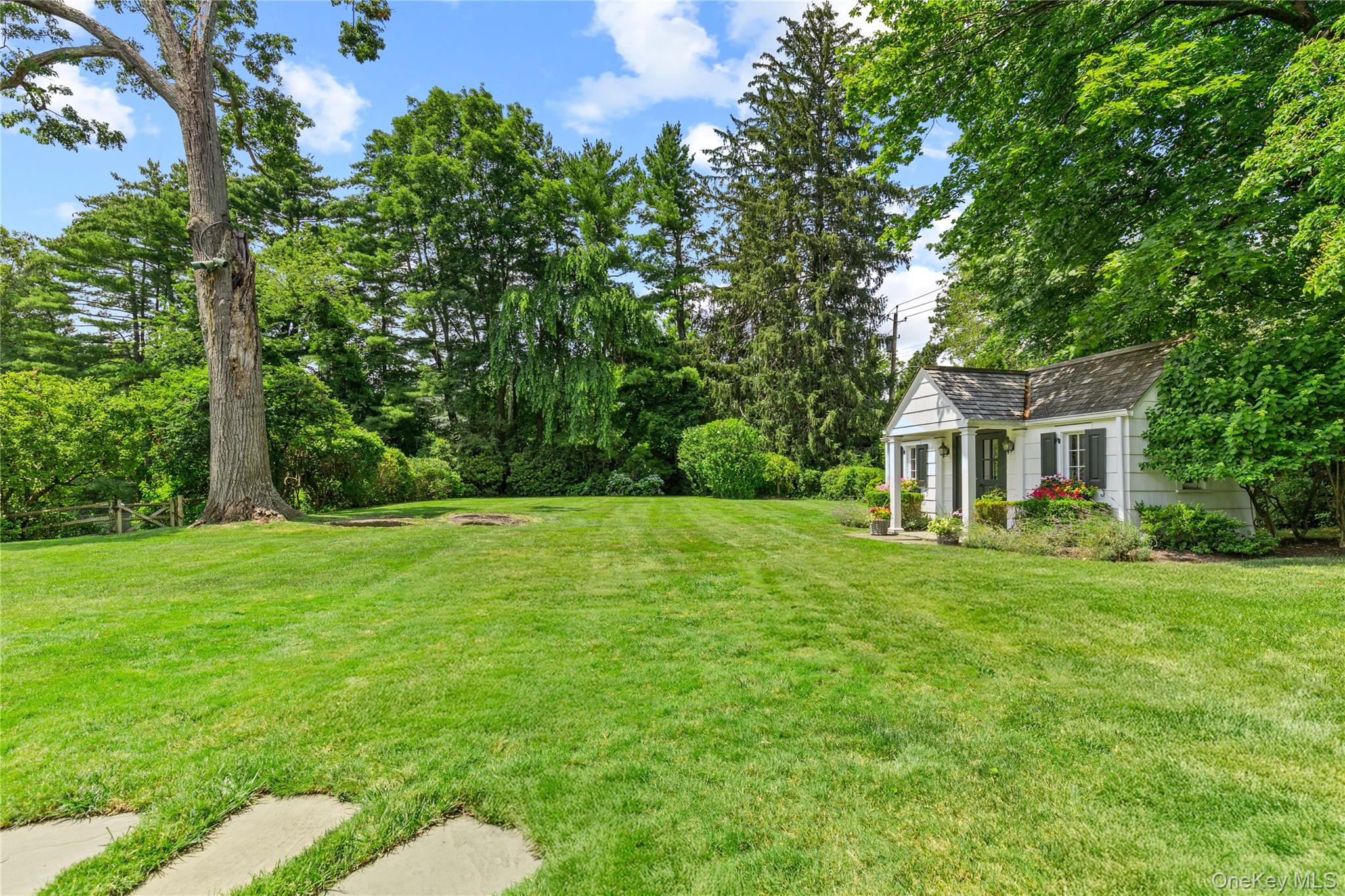 25 Stratford Road Harrison, NY 10528 - Photo 39 of 47 a front view of a house with a garden