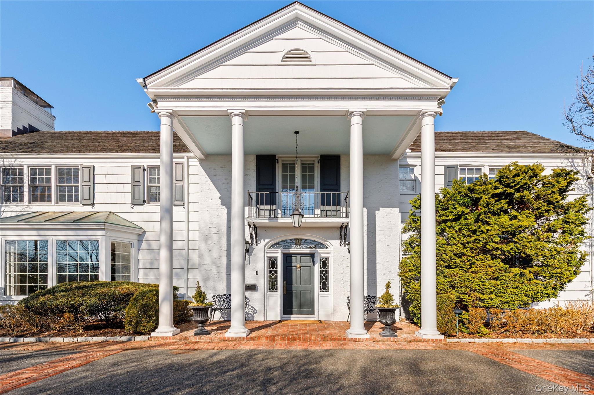 25 Stratford Road Harrison, NY 10528 - Photo 4 of 47 front view of a house with a street