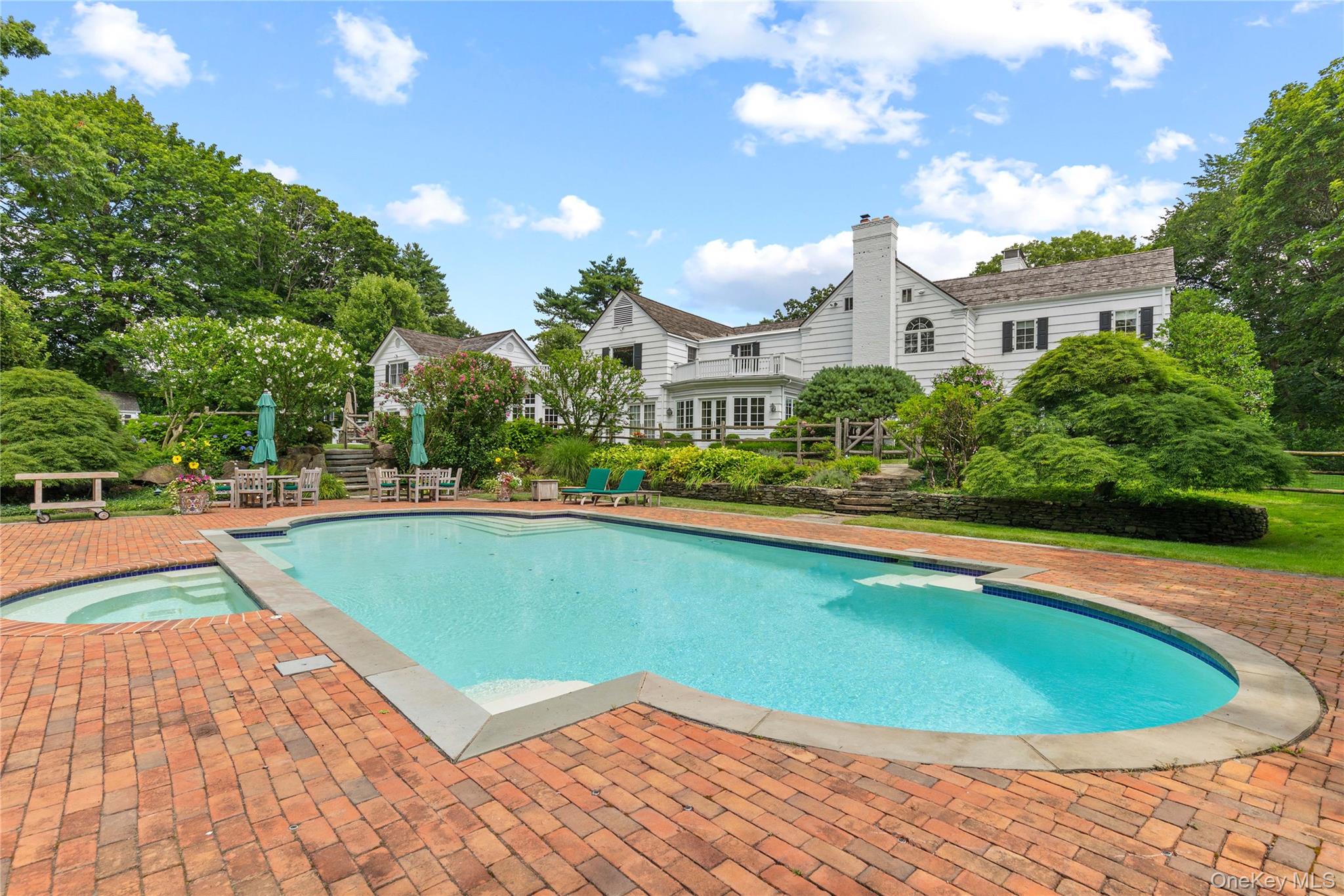 25 Stratford Road Harrison, NY 10528 - Photo 41 of 47 a view of a swimming pool with a patio