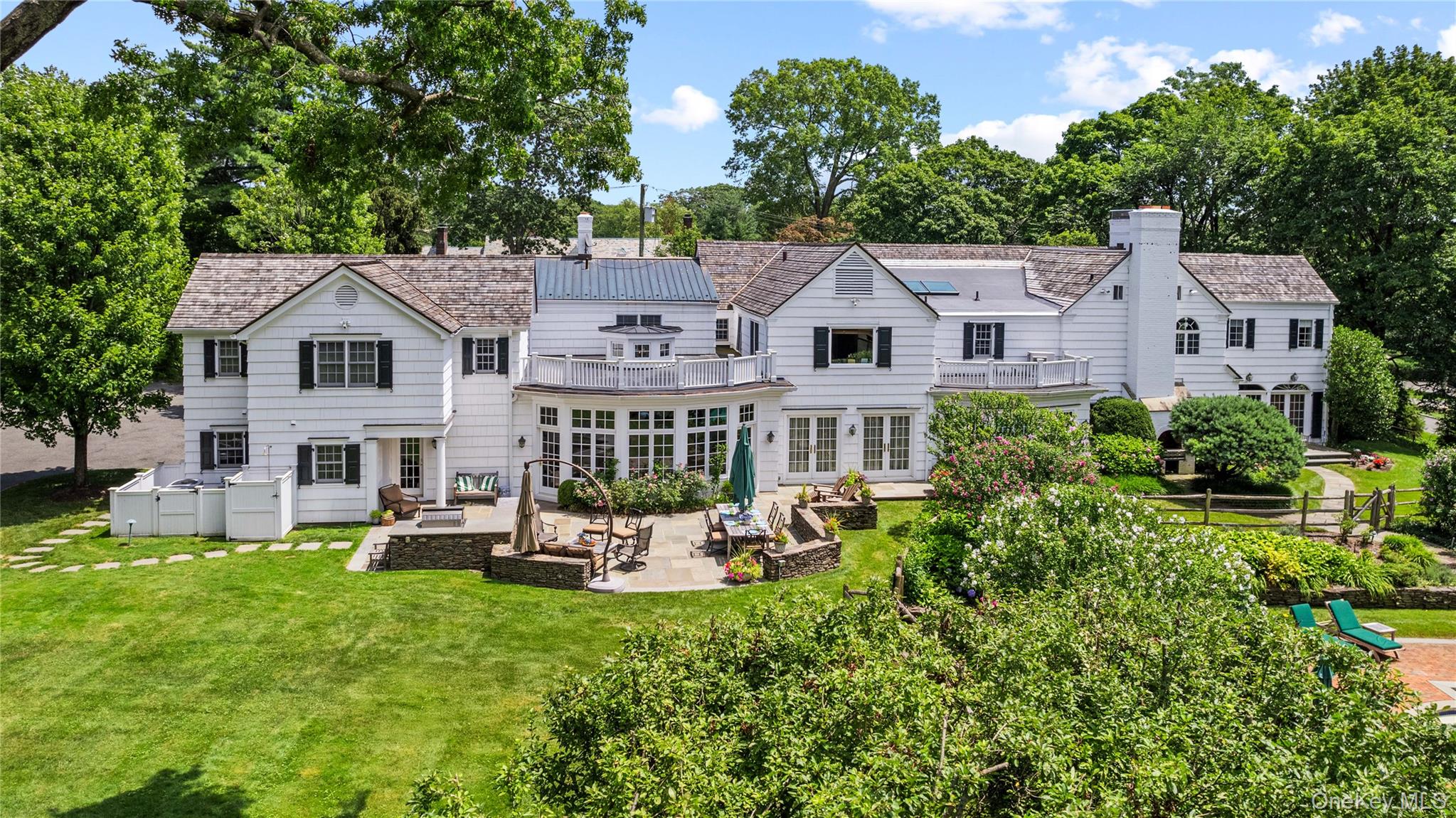 25 Stratford Road Harrison, NY 10528 - Photo 45 of 47 a front view of a house with garden