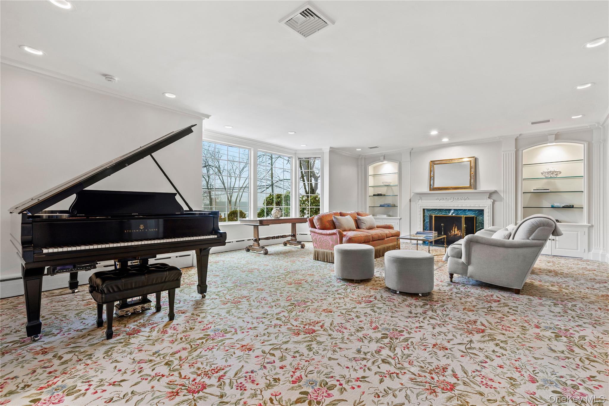 25 Stratford Road Harrison, NY 10528 - Photo 8 of 47 a living room with furniture a fireplace and a piano