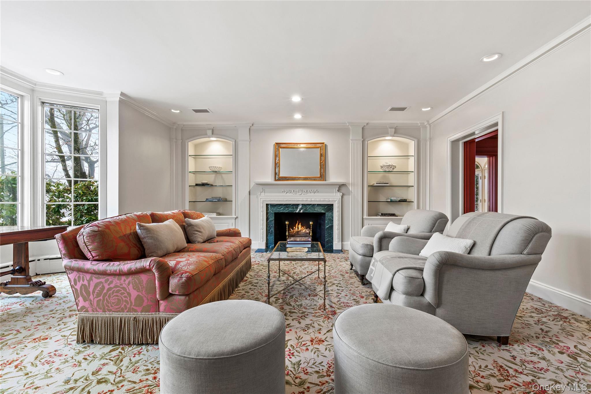 25 Stratford Road Harrison, NY 10528 - Photo 9 of 47 a living room with furniture and a fireplace