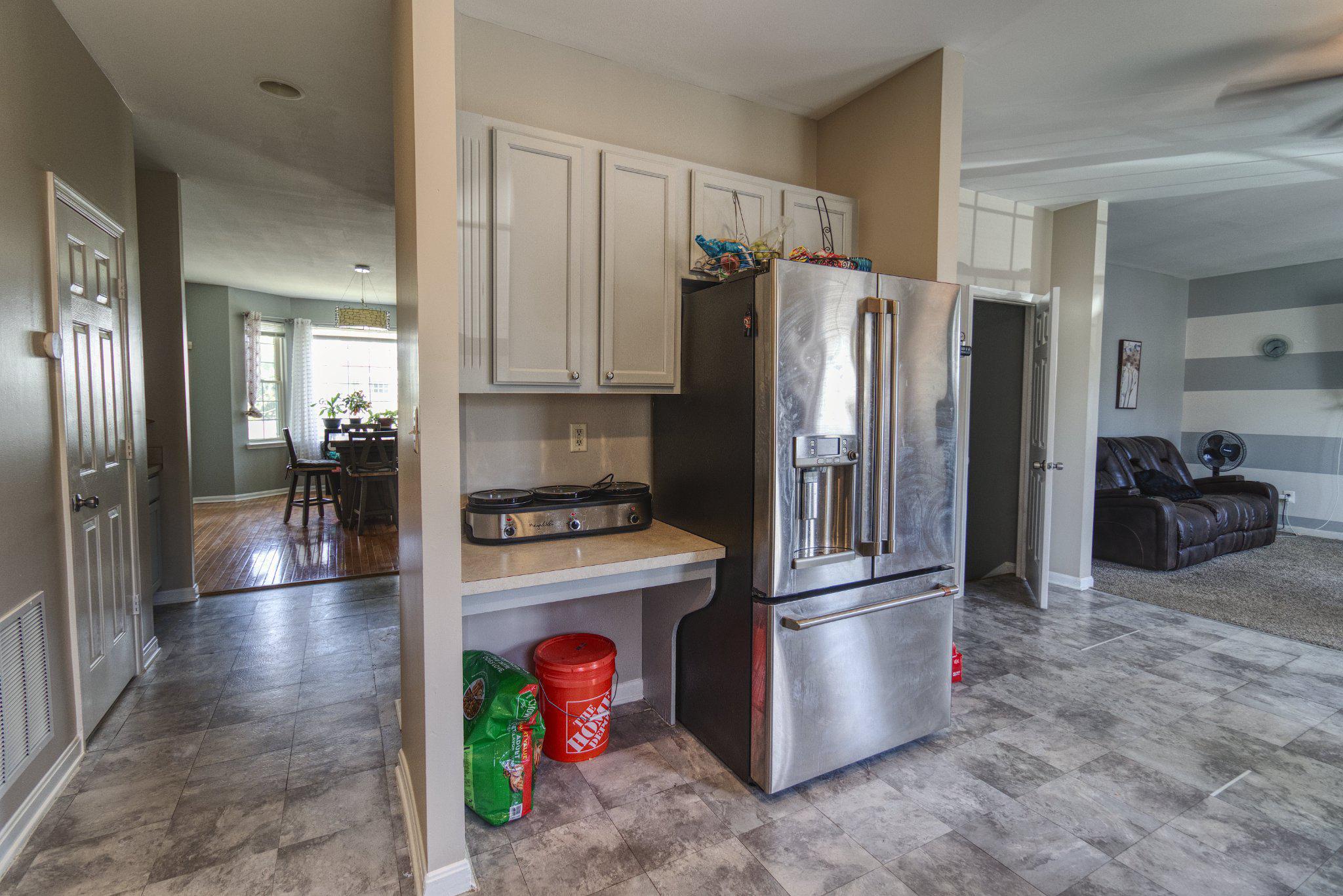 215 Seamaster Road Essex, MD 21221 - Photo 13 of 40 a kitchen with stainless steel appliances granite countertop a refrigerator a stove and a sink