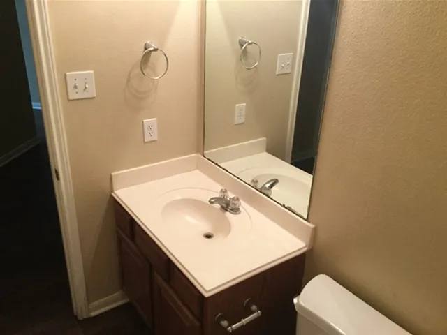 a bathroom with a sink and mirror